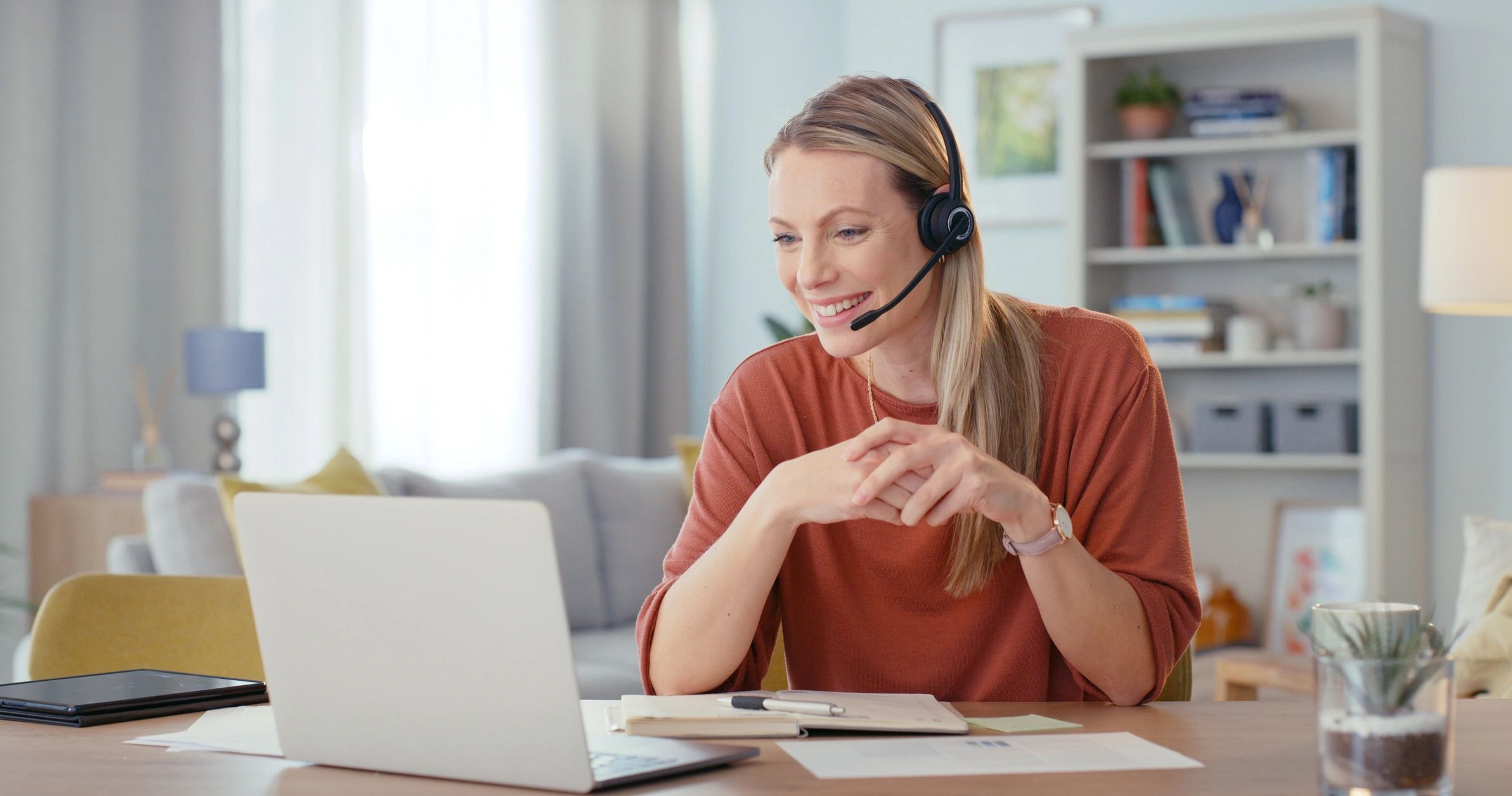 Personal assistant helping a client with video call and technology support
